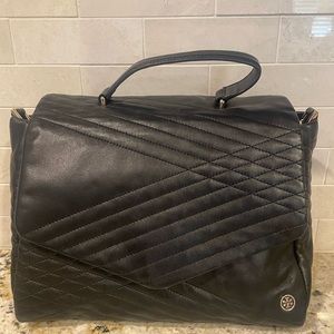 Tory Burch black quilted 797 satchel in good condition.